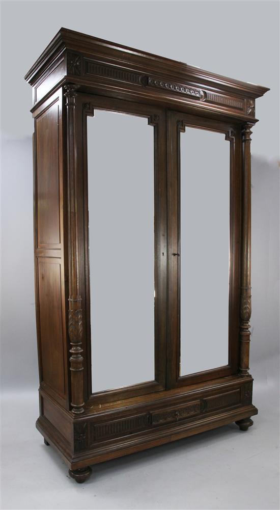 A French walnut two door armoire, late 19th century H.8ft 1in.